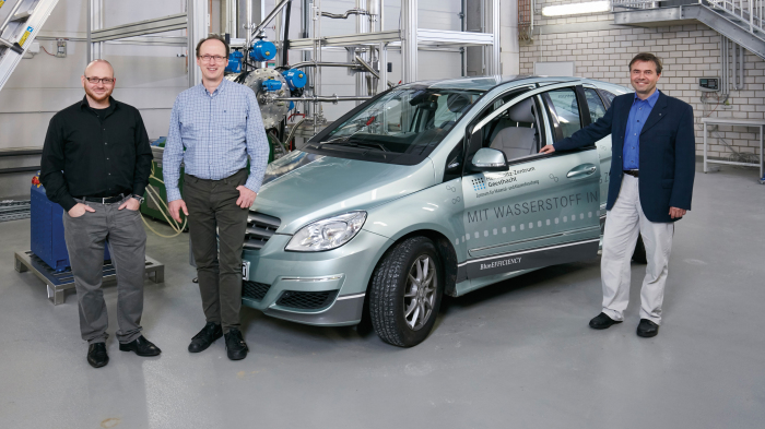 Scientists with hydrogen car.